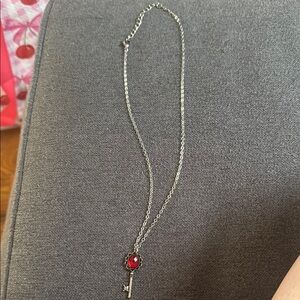 Elegant Silver Key Pendant Necklace with Red Gemstone